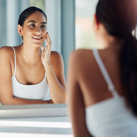 Woman using natural waterless cleansing balm