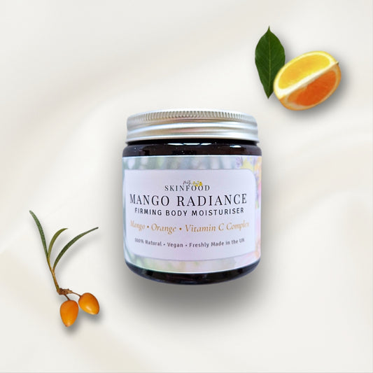 My Skinfood Mango Radiance firming body moisturiser with orange slices and sea buckthorn on a light background
