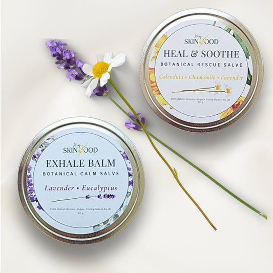 Two tins of My Skinfood salves balm with flowers on a light background