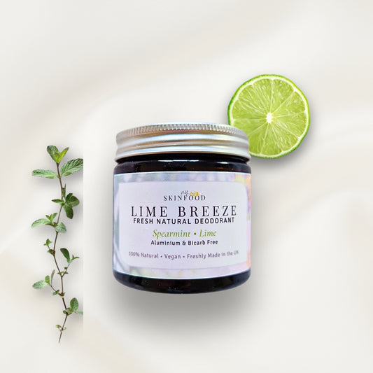 Jar of My Skinfood Lime Breeze natural deodorant with a lime and spearmint leaves on a light background