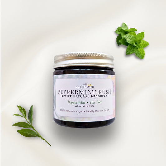 My Skinfood Peppermint Rush active deodorant jar with mint leaves on a light background