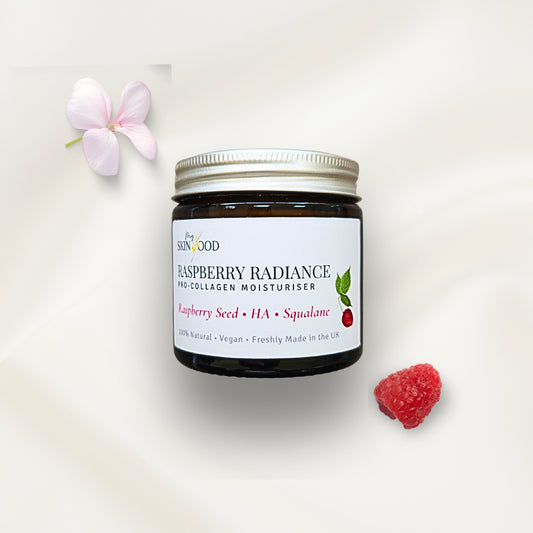 Jar of My Skinfood raspberry radiance mineral natural SPF moisturizer with a raspberry seed oil and flower on a white background
