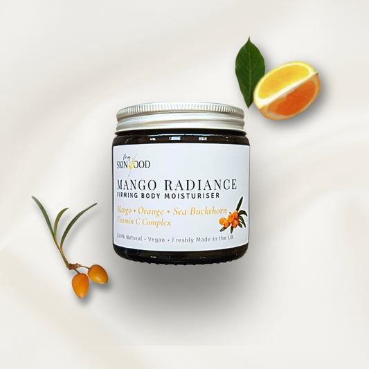 Jar of My Skinfood Mango Radiance firming body moisturizer with mango sea buckthorn and orange slices on a light background